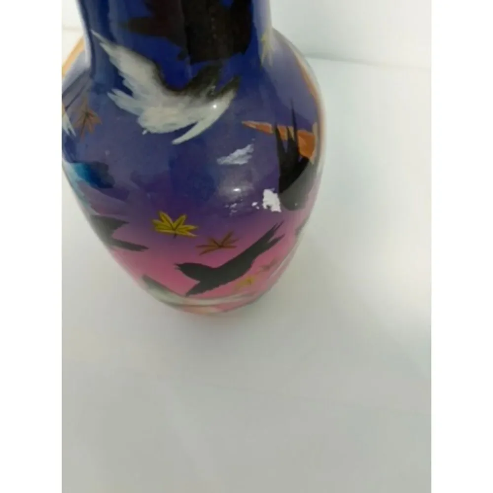 japanese vase with dark blue and pink ground, featuring birds